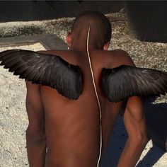 a man with black wings on his back