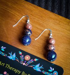 Goldstone and Blue Sandstone with genuine sterling silver hook earrings. Handmade in the USA using quality materials. Blue Sandstone, Indian Agate, Agate Earrings, Bookmarks Handmade, Hook Earrings, Earrings Handmade, Favorite Jewelry, Fails, Jewelry Earrings Dangle