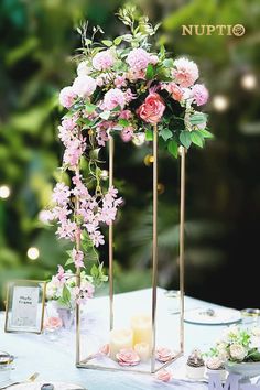 the table is decorated with candles and flowers