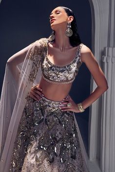 Light lilac attached cancan lehenga featuring sequin, bead and salli embroidery all over. Paired with a padded embroidered blouse featuring tassel detailing on the waist. Comes with an organza silk dupatta featuring cutwork border. - Aza Fashions Hand Embellished Purple Lehenga For Wedding, Glamorous Hand Embellished Sleeveless Lehenga, Glamorous Sleeveless Hand Embellished Lehenga, Lehenga Blouse, Silk Dupatta, Cut Work, Embroidered Blouse, Aza Fashion, Lehenga