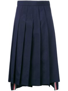 A wardrobe of reimagined - but never boring - classics, Thom Browne’s Spring/Summer 2019 collection takes uniform dressing to chic new heights. This navy wool blend School Uniform Pleated Skirt from Thom Browne features a high waist, a side zip closure, a high low hemline, a mid-length, branded gold-tone hardware, knife pleats and a tri-stripe grosgrain trim. School Uniform Long Skirt, Uniform Dressing, Pleated Skirt Blue, Pleated School Skirt, School Skirt, Knife Pleats, Pleated Long Skirt, Navy Skirt, School Clothes