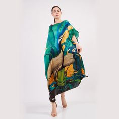 🌿 100% Silk Plus Size Long Dress For Women | Green | Loose Fit Dress Elevate your elegance with the Nomadsfelt touch - where the world's finest paintings meet the luxurious embrace of silk fabric. 👗 Versatile Elegance: This plus-size dress is your passport to day-to-night sophistication. Pair it with a chic belt and heels for evenings, or embrace comfort and style with sandals or sneakers during the day. 🌬️ Breathable Luxury: Immerse yourself in the airy, smooth comfort of this silk dress. Silk, the ultimate fabric for battling sweat, keeps you cool and offers a soft touch. It's the epitome of breathability, comfort, lightweight, and sheer luxury. 💎 Quality Assurance: Trust in quality without breaking the bank. I stand by the excellence of my products, welcoming returns if you're not d Green Silk Kaftan For The Beach, Green Silk Dress For The Beach, Green Silk Maxi Dress For The Beach, Green Silk Maxi Dress For Beach, Green Silk Dress With Kimono Sleeves, Silk Multicolor Kaftan With Vibrant Print, Green Silk Beachwear Dress, Vibrant Multicolor Silk Kaftan, Vibrant Silk Kaftan