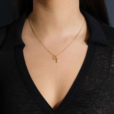 Two beautiful gold cross pendants hang from this delicate chain, giving it a little more flair than a traditional single cross necklace. It's an ideal gift for anyone who's about to celebrate a wedding, a confirmation or a First Communion. Made from high quality materials to last for years to come. Materials: 14K gold plated brass Features: Measures 16" with 2" extender, 10-14mm charms, Lead & Nickel free, lobster clasp Elegant Cross Charm Necklace With Adjustable Chain, Cross Pendant Charm Necklace With Adjustable Chain, Elegant Yellow Gold Cross Charm Necklaces, Gold Crucifix Necklace With Delicate Chain, Elegant Cross Necklace With Delicate Chain, Dainty Cross Pendant Necklace For Anniversary, Elegant Yellow Gold Cross Charm Necklace, Gold Cross Pendant Charm Necklace With Adjustable Chain, Gold Necklaces With Delicate Chain And Cross Pendant