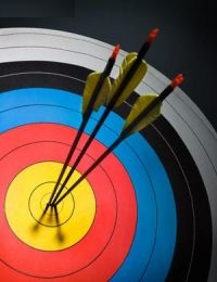 three arrows in the middle of a bullseye with red, yellow and blue darts