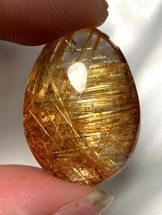 Material: Natural gold rutile crystal Shape: Teardrop Hole?: No hole Color: Clear, Gold Size: See the photo for size information. Weight: See the photo for weight information. Item Description: 1. We show four teardrop-shaped gold rutile crystals. They are all natural crystals, not dyed or heated. The gold material inside the crystal is also natural. 2. These items are hole-free. If you need us to provide you with hole-making services, please leave a message to contact us. 3. We will ship according to the number you choose. 4. Each photo is real. The video and photos are authentic. Standard shipping is expected to take 12-15 days, and fast shipping is expected to take 4-7 days. Rutile Quartz, Crystal Shapes, Quartz Beads, Crystal Items, Gold Material, Natural Crystals, Wedding Shop