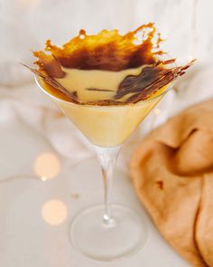 a dessert in a martini glass on a table