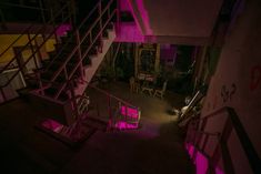 the stairs are lit up with pink light