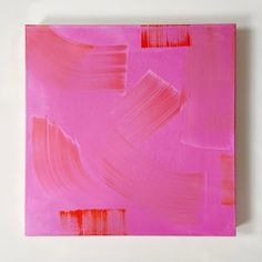 a pink painting on a white wall with red and pink paint streaks in the middle