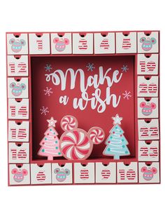 make a wish box with candy canes and christmas trees in the front, on a red background