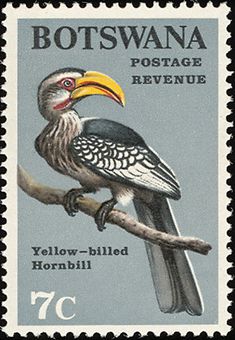 a stamp with a bird on it's back and the words, yellow - billed hornbill