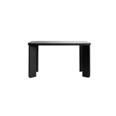 a black table sitting on top of a white floor