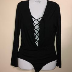 Long Sleeve Black Bodysuit With Shoe Lace Criss Cross Front. Medium, 95% Rayon 5% Spandex. Soft Material. Nwot Mb166 Black Fitted Bodysuit With Cross Back, Cute Black Long Sleeve Onesie, Black Stretch Cross-back Bodysuit, Black Low-cut Lined Bodysuit, Black Bodysuit Longsleeve, Tops Long Sleeve, Shoe Lace, Backyard Fire, Black Bodysuit