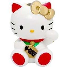 a hello kitty figurine sitting on top of a white table