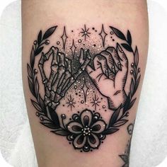 a black and white tattoo design on the leg