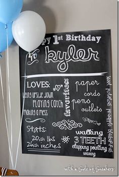 a chalkboard sign with balloons attached to it and the words happy birthday written on it