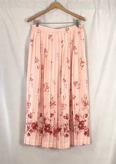 "Talbots -pink pleated georgette maxi skirt -fully lined -adorned with flowers  SIZE-16  Waistband relaxed -30\" looks and fees good stretched to 36\" Overall length -waistband to the hem-34\" set in waistband -in the front -with an elastic waistband in the back for comfort and fit Buttons at the side -with two buttons and a zipper Skirt and lining -polyester Dry clean only  Like new condition" Spring Pleated Flowy Maxi Skirt, Pink Chiffon Bottoms For Spring, Spring Maxi Skirt With Pleated Hem, Spring Full-length Flowy Skirt, Pink Floral Print Maxi Bottoms, Flowy Pink Pleated Maxi Skirt, Full Length Flowy Skirt For Spring, Elegant Pink Floral Print Maxi Skirt, Spring Fitted Maxi Skirt With Accordion Pleats