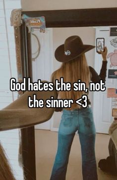 a girl with long hair wearing a cowboy hat and jeans