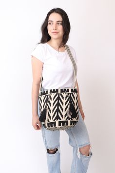 a Premium Quality Beige & Black Wayuu Purse handwoven in Crochet  By Women From the Wayuu Tribe in Colombia. This Beautiful 2 Thread Bag comed with a Long strap suitable for both Shoulder & Crossbody . - Sturdy & Wide enough to hold all your items and Accesories . Each Bag Takes up to 9 Days To Weave & they are a true Work of Art. Size : 27x23cm (Large) Strap : 110cm (crossbody) [41in] crochet purse , woven bag , woven wayuu purse. - 🌟Shipping: DHL : * USA, Central & North America: 2-3 Business Casual Handwoven Crossbody Bucket Bag, Casual Woven Shoulder Bag For Everyday Use, Casual Weaving Shoulder Bag For Everyday Use, Casual Handwoven Crossbody Shoulder Bag, Black Woven Crossbody Bucket Bag, Black Woven Bucket Bag, Black Handwoven Hobo Bag For Everyday, Black Woven Crossbody Shoulder Bag, Black Rectangular Shoulder Bag With Weaving