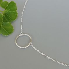 "A Sterling silver neck chain with a circle charm. Dimensions: Circle: 14.5 mm Length: 16 to 18\" This necklace is made of 925 hypoallergenic sterling silver. Most of my pieces come with a 925 stamp. Please go through all the pictures posted for this item to gauge the actual size. Can be packaged in a gift box. I can include a personal message from you if needed You are welcome to contact me at... bhavnakwintra1956@gmail.com For more beautiful pieces from my shop, please browse 👇 TOE RINGS: htt Adjustable Simple Silver Necklaces, Adjustable Minimalist Charm Necklace With Silver Chain, Minimalist Silver Chain Charm Necklace, Adjustable, Minimalist Charm Necklace With Silver Chain, Minimalist Silver Chain Charm Necklace, Minimalist Circle Sterling Silver Charm Necklace, Circle Charm Necklace, Necklace Minimalist Jewelry, Necklace Circle