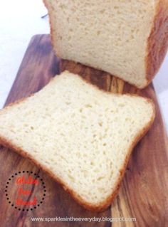 two slices of bread sitting on top of a wooden cutting board