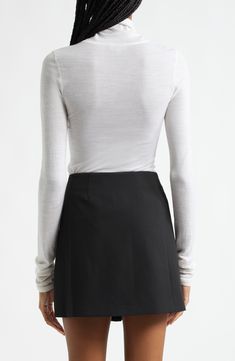 Build out your collection of capsule-wardrobe essentials with this layering-friendly turtleneck cut from a featherweight blend of cotton and nylon. 23 1/2" length (size Medium) Turtleneck Long sleeves 78% cotton, 22% nylon Dry clean Imported Chic Fitted Turtleneck For Layering, Turtleneck For Layering, Fitted Fine Knit Turtleneck For Layering, Fine Knit Turtleneck For Spring Workwear, Spring Fine Knit Turtleneck For Work, Fitted Turtleneck For Spring Layering, Capsule Wardrobe Essentials, Turtleneck Top, Turtle Neck Top