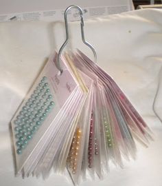 there are many different colored pins on the clothes pegs that have been placed together