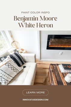 a living room with a white couch and fireplace in the background text reads paint color info benjamin moore white heron