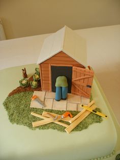 a cake that is shaped like a barn