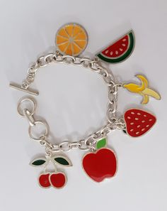 Handmade Bracelet Fruit Mix Charm Bracelet Womens Girls Boho Rainbow Colorful Enamel Charm Silver Tone Arty Modern Design Huge Toggle CLASP Everyone LOVES these handmade bracelets... FABULOUS Colorful fun happy festive pop art easy to wear and very durable. Fun JUMBO FRUIT charm, bracelet is 7 1/2 to 9 inches long total and has a jumbo sized toggle clasp THAT MAKES IT EASY FOR YOU TO GET OFF AND ON YOURSELF Great for Women and Girls. Bracelet is stainless steel hypoallegenic all safe metals. Exc Novelty Multicolor Charm Bracelet, Playful Handmade Silver Charm Bracelet, Trendy Multicolor Charm Bracelet, Fun Silver Metal Jewelry, Cute Multicolor Nickel-free Bracelets, Cute Multicolor Nickel-free Bracelet, Playful Silver Adjustable Charm Bracelet, Trendy Multicolor Charm Bracelet With Lobster Clasp, Playful Handmade Silver Bracelets