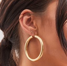 Classic gold hoops. Simple yet bold and stunning. It pairs well with any outfit. These hoops are made of stainless steel, so waterproof! The color remains perfect. Gold: 18k gold platingMaterial: Stainless steelWidth: 51mmThickness: 8.5mm Waterproof jewelry Hypoallergenic Tarnish Free Glazd Pouch with every order Free US shipping Easy Exchange & Return policy PRODUCT INFOAll our jewelry are made of stainless steel material. For the gold pieces, we added an 18K PVD gold plating. This means the co Elephant Earrings Studs, Tube Hoop Earrings, Cross Earrings Studs, Diamond Evil Eye, Solitaire Earrings, Bar Stud Earrings, Evil Eye Earrings, Coin Earrings, Butterfly Earrings Stud