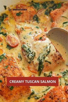 creamy tuscann salmon with spinach and tomatoes in a white sauce on top