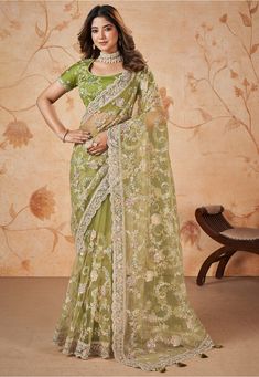 Net Scalloped Saree in Light Green This drape is Enhanced with Resham, Zari and Sequins Work Available with a Semi-stitched Art Silk Blouse in Light Green. Crafted in Round Neck and Short Sleeve Do note: 1.)Accessories shown in the image are for presentation purposes only. 2.)Slight variation in actual color vs. image is possible. Green Net Saree, Sequins Saree, Sequins Blouse, Dress Saree, Gorgeous Lady, Sequin Saree, Design Saree, Modern Saree, Green Saree