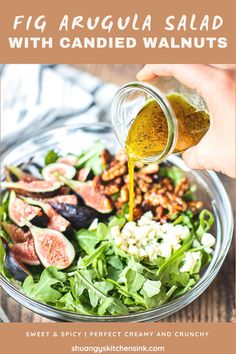 a person pouring dressing onto a salad with figs and candied walnuts on the side