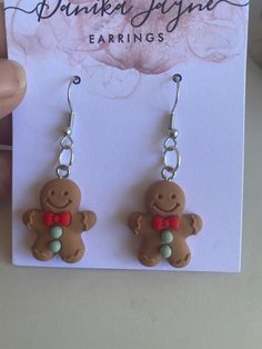 a pair of earrings with a ginger on it