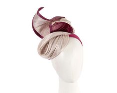 This elegant fashion fascinator hat is an ideal complement for any outfit. Wear it at Melbourne Cup, Ascot, Kentucky Derby or any other special occasion and it is guaranteed to turn heads! Hand made in Melbourne from twists of luxurious pink and burgundy wine silk abaca fabric, this fascinator hat is mounted on the band for better fit.  Made in Australia  Renown Fillies Collection brand  Luxurious silk abaca fabrics  Unique design   On request, colors can be customised to suit your outfit Elegant Burgundy Hat For Kentucky Derby, Luxury Pink Chic Fascinator, Luxury Fitted Pink Fascinator, Pink Curved Brim Fascinator For Events, Luxury Pink Headband Fascinator, Luxury Hat-shaped Fascinator For Races, Pink And Burgundy, Pink Wine, Melbourne Cup