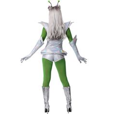 a woman in green and white costume standing with her hands on her hips while wearing silver boots