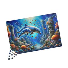 Explore the mystical depths of the ocean with our "Dolphins in Atlantis Ruins" jigsaw puzzle. This captivating puzzle features a mesmerizing scene of dolphins gracefully swimming through the ancient ruins of Atlantis, surrounded by vibrant coral reefs and diverse marine life. Perfect for dolphin enthusiasts and puzzle lovers alike, this beautifully illustrated puzzle promises hours of relaxing and engaging fun. Whether for a family game night, a thoughtful gift, or a stunning decor piece, this p Atlantis Ruins, Ocean Scenes, Coral Reefs, Ancient Ruins, Family Game Night, Coral Reef