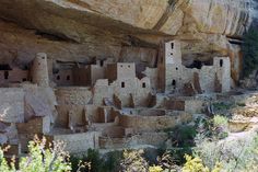 people are standing in front of the cliff dwellings at mesa de oro, mexico