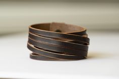 "Stacking Boho Style Leather Cuff Bracelet ♡ Rustic Brown + Antique Brass ♡ Handmade To Order Gift For Her | Gift For Him | Gift For YOU! M A P L E L E A T H E R C R A F T ∙ D I F F E R E N C E The difference is in the details. I handcraft each bracelet to order from the highest quality materials. All of my leather is real full grain vegetable tanned leather. I use this leather because it is the highest quality and has the best durability of any natural leather.  I hand cut 1\" leather strips and then cut again to create the look of an 8 strip stacking bracelet. I hand burnish the edges to give it that beautifully finished look and use solid brass button stud closure. Create a custom bracelet by choosing your leather color, hardware color (brass, antique brass or brushed nickel) and sizing Double Wrap Leather Bracelet, Custom Bracelet, Leather Cuff Bracelet, Classic Bracelets, Brass Antique, Wrap Bracelets, Bracelet Boho, Leather Cuffs Bracelet, Leather Gifts