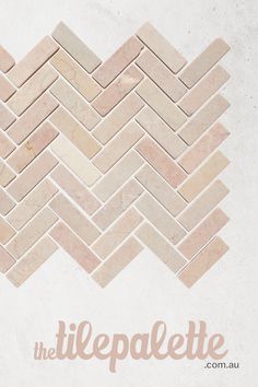 the tile pattern is made up of different shapes and colors, including pinks and browns