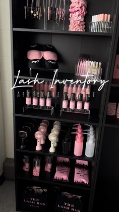 a shelf filled with lots of pink and black items