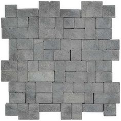 a gray brick wall that is made out of blocks