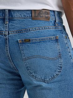 Providing the tried-and-true style you love with the comfort you need to last all day long, this men's Legendary bootcut jean will give you every excuse to dress casually, no matter what the day has in store. It features all of the time-tested details that are unique to Lee jeans, including five-pocket styling, spade pockets with the S-curve embroidery, a hip pocket label, X-tacks, logo rivets, a patch label, and a branded button with zipper fly. It's made from a comfortable cotton blend containing just a little bit of stretch to keep you moving until the day is done.All you need to complete the look is a button-up for the week or a graphic tee for the weekend. Mens Fashion Jeans, Lee Jeans, Bootcut Jeans, Jeans Style, Mens Jeans, Cotton Blend, Graphic Tees, Pants, Clothes