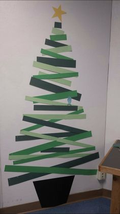 a christmas tree made out of strips of paper