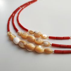 < Coral and Pearl Necklace > This product made according to the model of authentic traditional Ukrainian jewelry. The coral is modern, the design is vintage. Like 99% of the coral on the market these days, this coral has been dyed. I use bamboo coral which is not endangered or threatened in any way, unlike natural pink or red coral (the production of which is forbidden almost everywhere in the world). Bamboo coral doesn't mean it's not organic. Every bead of it has a distinctive and beauti Gift Shell Necklace With Polished Round Beads, Ukrainian Jewelry, Summer Choker, Bamboo Coral, Mother Of Pearl Necklace, Coral Jewelry, Coral Beads, Mother Pearl, Red Coral