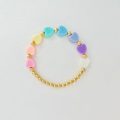 This cute heart bracelet has 4mm gold filled beads and 8 pastel heart beads. Comes in adult sizes too if you want matching bracelets 💗 🤍 Please check all selections prior to check out. Our custom bracelets are made to order so all sales are final.  🤍 The bracelets are beautifully packaged and ready to gift. Receipts are never included in your package.  🤍 Roll, don't pull. To avoid excess stretching please roll the bracelet on and off. Treat and store the bracelets gently. 🤍 Sizing options a Pastel Heart, Toddler Bracelet, Kids Bracelet, Girls Heart, Girl Accessories, Kids Bracelets, Girls Girl, Cute Heart, Bead Shop