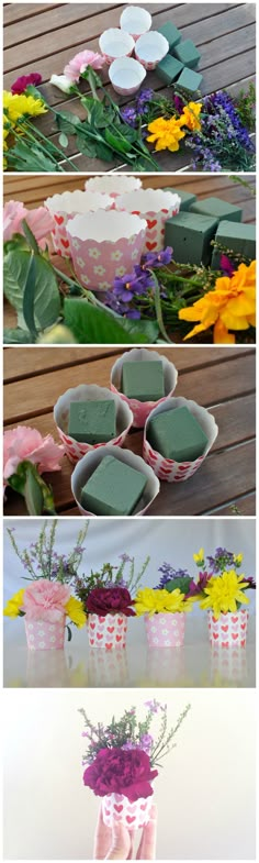 flowers and soaps are arranged in vases on a table, with the same flower arrangement