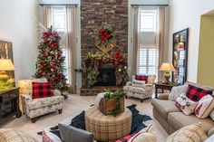 a living room filled with furniture and christmas decorations