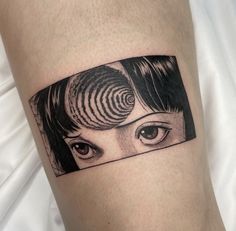 a woman's face with an eye on the side of her arm