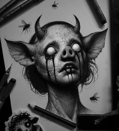 a drawing of a demon with big eyes and horns on it's head, surrounded by flies